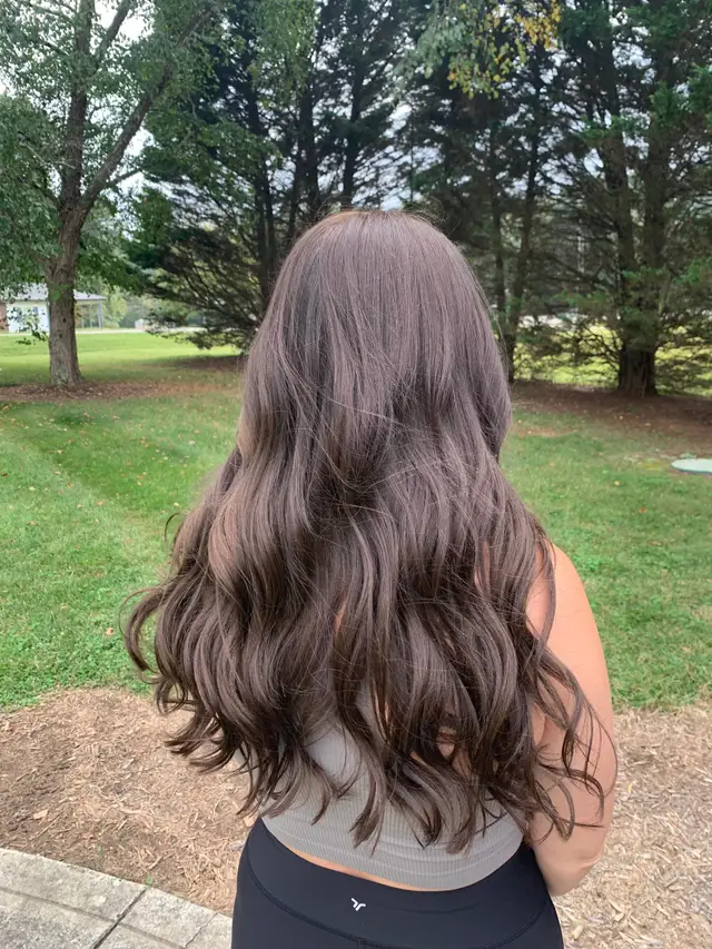 Dimensional brunette color with subtle warm lowlights, photographed outdoors